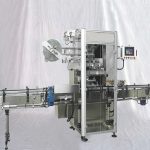 Machine d'étiquetage automatique de manchons thermorétractables pour capsules de bouteilles