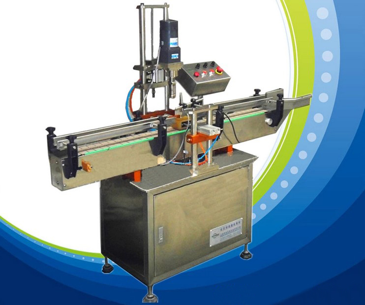 capsulage tête unique automatique.jpg