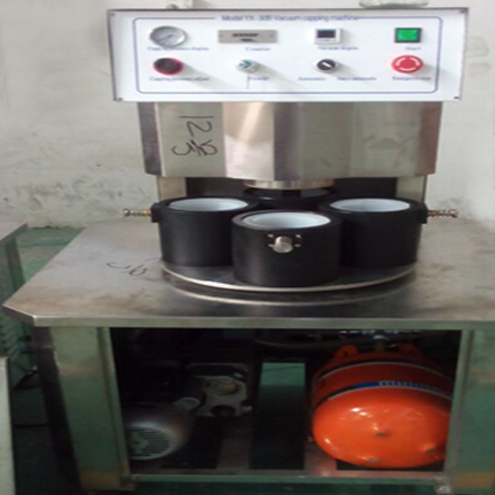 illustration of vacuum capping machine semi automatic illustration pour le bouchage sous vide.jpg